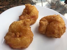 three fried food items on a white plate