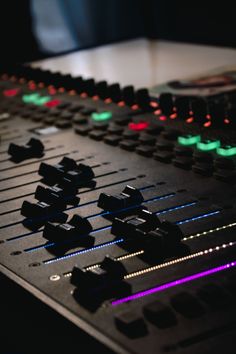 the sound board is lit up and ready to be used for mixing or other music