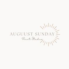 the logo for august sunday art studio, with sunbursts in the background