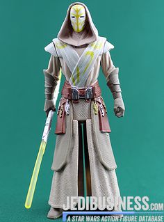 star wars action figure with lightsaben and mask on holding a yellow stick in his hand