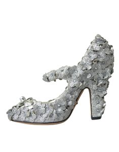 The Dolce & Gabbana Silver Floral Crystal Mary Jane Pumps Shoes are adorned with exquisite silver floral and crystal embellishments. Model: Mary Jane’s pumps Material: 66% Cotton 30% PS 4% Leather Color: Silver Crystal: Clear Leather sole Made in Italy Luxury Embellished Heels For Reception, Silver Heels With Rhinestones For Reception, Luxury Heels For Reception, Luxury Embellished Silver Heels, Luxury Silver Embellished Heels, Silver Sequined Heels For Wedding, Luxury Rhinestones Heels For Reception, Luxury Sequined Heels For Wedding, Silver Glamorous Heels For Reception