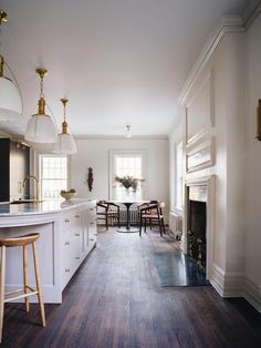 the kitchen is clean and ready to be used as a dining room or breakfast nook