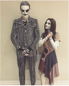 two people dressed up in costumes standing next to each other