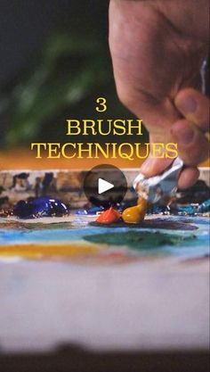 a person is using a brush to paint on a piece of paper with the words 3 brush techniques