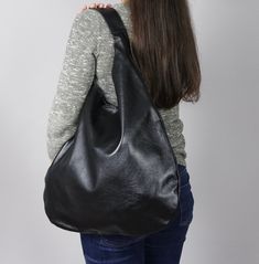 Oversized bag - hobo bag black Dimensions: Height from top of handle to base: 66cm (26 inch) Width at widest point: 49cm (19.2 inch) Large hobo bag made from high quality leather. This leather handbag can be worn on your shoulder, on the forearm or in your hand. This leather bag is a perfect everyday bag! There is a lot of space and you can put there everything in your everyday life. * Top closure magnet for security * Includes internal pockets for mobile phone and other small items Shipping: * Black Hobo Bucket Bag For Shopping, Black Hobo Bag With Leather Handles For Errands, Versatile Black Hobo Bag, Black Leather Hobo Shoulder Bag, Black Soft Leather Hobo Shoulder Bag, Everyday Black Hobo Bag, Black Hobo Bucket Bag For Daily Use, Black Hobo Bag With Removable Pouch, Versatile Black Hobo Bucket Bag