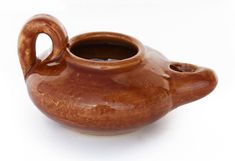 a brown ceramic tea pot with a handle