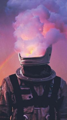 a man in space suit with helmet on his head and clouds coming out of the back