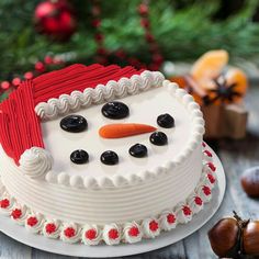 there is a cake decorated like a snowman