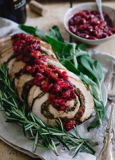 a turkey breast with cranberry sauce and herbs