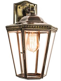 an old fashioned light fixture on a white background