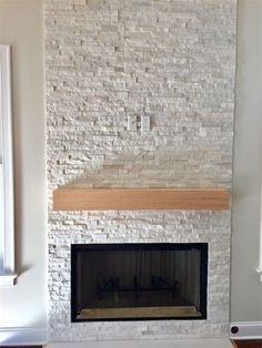 a white brick fireplace in a living room