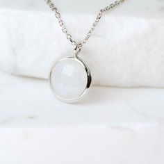 Dainty Moonstone necklace for women in 14K solid gold. A dainty gold birthstone necklace ideal for birthday gift or for Christmas. Genuine rainbow moonstone pendant on 14K solid gold chain with a spring clasp. Moonstone is also June birthstone.  100% handcrafted with love! D E T A I L S● Metal: 14K solid gold, 14K white gold or 14K rose gold● Gemstone: Moonstone, round briolette cut ● Stone Diameter: 10mm (0.4in)● Length: 39cm (15.5in) to 47cm (18.5)H O W ∙ T O ∙ O R D E RChoose from the drop do White Birthstone Necklace With Round Pendant, Minimalist White Pendant Birthstone Necklace, White Birthstone Round Pendant Necklace, Dainty Moonstone Charm Necklace For Gift, Minimalist White Gemstone Birthstone Necklace, Dainty White Round Birthstone Necklace, Minimalist White Birthstone Necklace, White Delicate Birthstone Necklace, Delicate White Birthstone Necklace