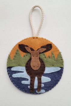 a moose ornament hanging on a wall