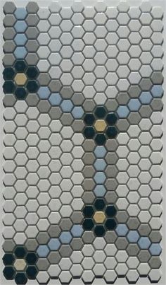 a mosaic tile design with different colors and shapes