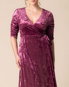 Our Cara Velvet High Low Wrap Dress exudes luxury with its rich, crushed velvet fabric and vintage-inspired ruching at the neckline and sleeves. The hi-low hemline adds movement, showing just a hint of skin for a chic touch. Perfect for the best dressed wedding guest, or when the invite calls for holiday, formal, or semi-formal attire. This elegant plus size special occassion maxi dress is designed exclusively for curvy figures. Formal Velvet Ruched Dress, Fitted Ruched Velvet Dress, Velvet Ruched Dress For Gala, Ruched Velvet Gala Dress, Fitted Crushed Velvet Party Dress, Formal Ruched Velvet Dress, Elegant Fitted Crushed Velvet Dress, Best Dressed Wedding Guest, Jumpsuit And Cardigan