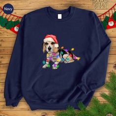 Beagle Christmas Sweatshirt, Cozy Dog Hoodie, Christmas Lights Shirt, Gifts For Dog Lovers, Dog Mom Sweatshirt, Dog Dad Gift, Dog Owner Tee HOW TO ORDER 1-) Please, check and review all photos and video 2-) Choose your product style, color, and size  3-) Enter your Text/Design In The Personalization Box (If applicable) 4-) Click add to cart. You can go back and follow the same steps to add more items to your cart 5-) Click "Proceed to check out" 6-) Add your shipping address and choose your ship Long Sleeve Winter Sweatshirt With Dog Print, Winter Long Sleeve Sweatshirt With Dog Print, Holiday Hoodies, Santa Dog, Dog Mom Sweatshirt, Cozy Dog, Dog Dad Gifts, Christmas Hoodies, Dog Hoodie