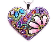 // Solid Sterling Silver Micro Mosaic Heart Shaped Pendant // This beautiful, individually hand-crafted pendant is made with Austrian Crystals and Dichroic Glass, all carefully set by human hands. The pendant beautifully glistens and sparkle in the light, and are sure to attract compliments! This pendant is one of a kind... You will receive the exact item pictured! These pieces are designed for our shop in Guadalajara, Mexico, by young women who are mostly single mothers, who have discovered the Multicolor Sterling Silver Heart Pendant Necklace, Multicolor Metal Heart Pendant Jewelry, Multicolor Metal Heart Pendant Necklace, Multicolor Heart-shaped Necklace For Gift, Artisan Jewelry Necklaces, Multicolor Heart-shaped Glass Necklaces, Heart Shaped Necklace, Micro Mosaic, Heart Shape Pendant