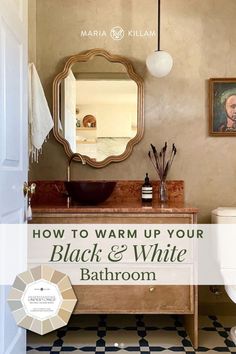 a bathroom with black and white checkered flooring, an old fashioned sink and mirror