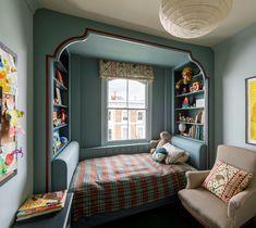 a child's room with a bed, chair and bookshelf in it