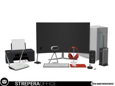 there is a computer monitor, keyboard, mouse and speakers on the desk with headphones