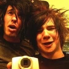 two young men taking a selfie with a camera