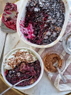 blueberry cobbler in a bowl with ice cream and other desserts around it