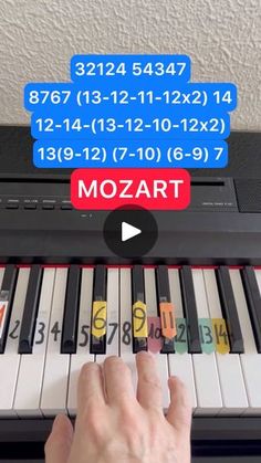 someone is playing the piano with different numbers on each key, and then pressing them to play it