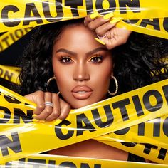 a woman is surrounded by caution tape