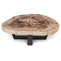 a wooden table with black metal legs and a wood slab on the top, in front of a white background