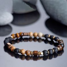 - Material:Tiger Eye Stone, Jasper Stone, Lava Stone - Length: fit for 6~ 8,2 inches wrists - Beads size:4mm **The size of this special stone bracelet, which provides Spiritual Protection and Patience, is adjustable. Suitable for men and women. It is a wonderful and unique gift option for special occasions such as Christmas, birthdays and anniversaries. **The appearance of natural stones can vary due to their unique characteristics and natural variations in color, size, and pattern. **Packaging: Stone Bracelet For Men, Pattern Packaging, Lava Stone Bracelet, Tiger Eye Gemstone, Bracelet Minimalist, Spiritual Protection, Tigers Eye Gemstone, Tiger Eye Stone, Eye Stone