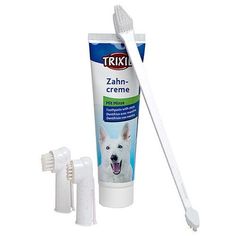 a toothbrush and tube of toothpaste on a white background