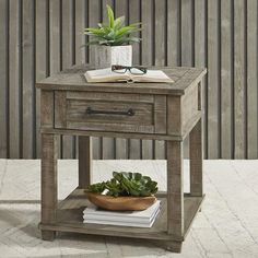 a wooden table with a potted plant on top