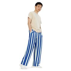 Fun blue and white stripes make these the coolest casual lounge pants. Pajamas for bedtime or just comfy wide-leg pants for kicking back around the house or hanging out and watching the basketball game. PJLove pants feature a relaxed unisex fit and can be worn comfortably on the waist or the hips. Elastic waistband with white drawstring for ultimate sizing versatility. With practical side pockets, our pjs/lounge pants are made of premium knit mid-weight (6.19 oz/yd2) jersey fabric...about the th Casual Summer Sleepwear Trousers, Casual Wide Leg Sleepwear, Blue Striped Pants For Spring, Blue Vertical Stripes Pants For Spring, Casual Wide-leg Pants With Vertical Stripes, Casual Striped Cotton Sweatpants, Casual Blue Sleepwear Pants, Casual Bottoms With Contrast Stripes And Long Pants, Casual Summer Pants With Vertical Stripes