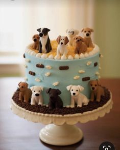 a cake with dogs on it sitting on a table