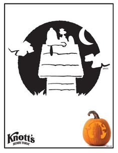 an orange pumpkin sitting on top of a table next to a black and white poster