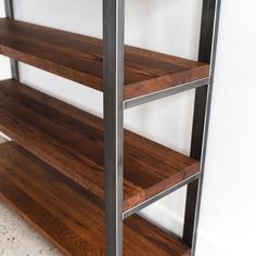 the shelves are made out of wood and metal, with one shelf on each side