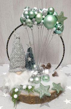 a table topped with christmas decorations and balloons