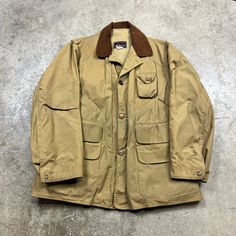 "good vintage condition. dirty. some wear. size tag is unreadable. please check measurements. please refer to approximate measurements (flat) below - may not fit as tagged pit to pit - 23\" collar to hem - 33\" if you have any questions, please ask." Vintage Cotton Sport Coat For Work, Vintage Khaki Sport Coat For Work, Vintage Khaki Single-breasted Sport Coat, Vintage Single-breasted Khaki Sport Coat, Vintage Long Sleeve Sport Coat For Outdoor, Vintage Khaki Sport Coat With Buttons, Vintage Beige Sport Coat For Work, Vintage Winter Hunting Outerwear, Vintage Beige Cotton Outerwear