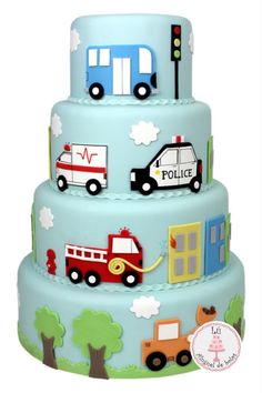 a three tiered cake with cars and trucks on it