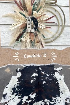 a cowhide rug is shown next to an old wagon wheel with the words couvidde 2 on it