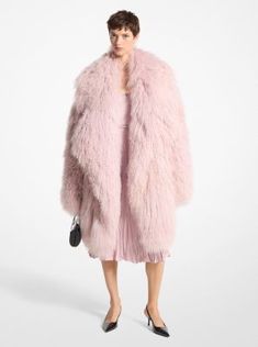 Crafted from genuine Mongolian shearling, this coat is traditional in shape but anything-but in fabrication. It’s designed in a shawl collar silhouette with an open front, and descends to a knee-grazing length. Style it as Michael did on the Fall/Winter 2024 runway with a textured slip dress. Mongolian Fur Coat, Boho Mom, Pink Fur Coat, Winter Cape, 2024 Runway, Mongolian Lamb, Fur Cape, Stil Boho, Pink Fur