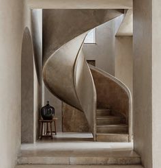 an artistic spiral staircase in a modern home