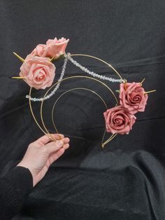 Elevate your style with our handcrafted gold and pink mottled rose beaded headdress.  Designed by a professional props maker, this headpiece features a gold metal crown adorned with intricate beaded embellishments and gold spikes.  Perfect for festivals, weddings, Ibiza parties, Pride events, LGBT gatherings, raves, and parties, it offers an alternative yet elegant look.  Customisable to suit your preferences, this unique and durable headdress stays securely in place, ensuring you stand out with Beaded Headdress, Ibiza Party, Beaded Rose, Beaded Embellishments, Prop Maker, Metal Crown, Head Dress, Gold And Pink, Costume Hats