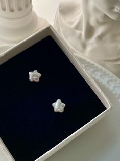 Indulge in celestial charm with these White Pearl Star Stud Earrings. Simple yet elegant, these stud earrings are perfect for everyday wear or as a subtle addition to any special occasion outfit. The unique star design and shimmering white pearls combine to create a graceful and timeless look that will capture the admiration of all who see them. Expertly crafted with high-quality materials, these earrings are a lasting symbol of your impeccable taste and refined sensibilities. Pearl Star Earrings, Cute Earrings Studs, Star Things, Pearl Earrings Studs, Star Pearl, Trendy Stud Earrings, Aesthetic Earrings, Star Stud Earrings