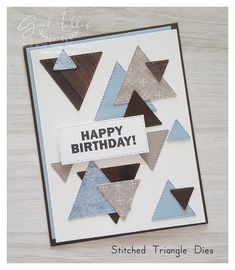 a handmade birthday card with blue and brown triangles on it, which reads happy birthday