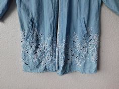 "Chico's women's denim light coat Distressed denim Frayed hem, white stitches all around Two side pockets Open front 3/4 sleeve Floral embroidery - see photos Back split Great condition Dimension shoulder 18\" armpit to armpit 25\" sleeve 18.5\" length 35\"" Denim Blue Outerwear With Frayed Hem For Summer, Summer Light Wash Outerwear With Frayed Hem, Relaxed Fit Outerwear With Frayed Hem For Summer, Oversized Summer Outerwear With Frayed Hem, Oversized Outerwear With Frayed Hem For Summer, Bohemian Denim Blue Summer Outerwear, Spring Outerwear With Frayed Hem In Washed Blue, Summer Outerwear With Floral Embroidery In Medium Wash, Summer Floral Embroidery Medium Wash Outerwear