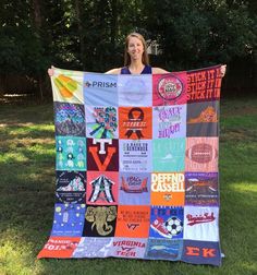 a woman is holding up a quilt made with different types of t - shirts