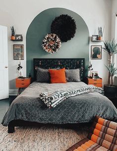 a large bed sitting in a bedroom next to a green wall