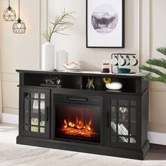 an entertainment center with a fireplace in the middle