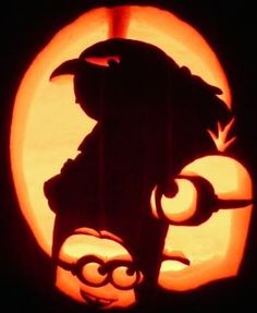 a carved pumpkin with an image of a bird on it's head and the moon in the background